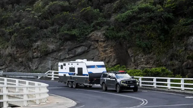 a car and a trailer in a road